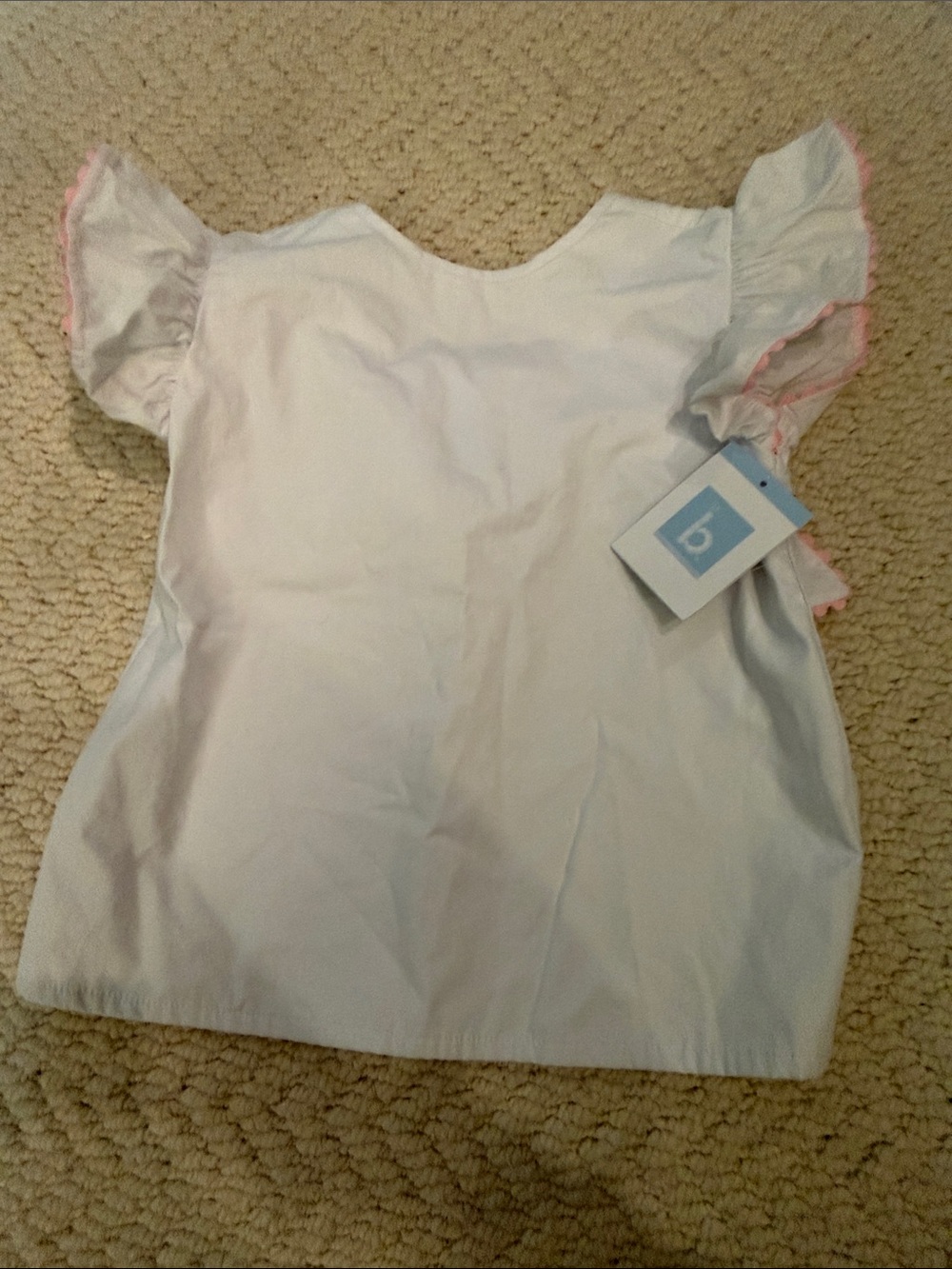 Adorable white T with pink ribbon detail and bow on back